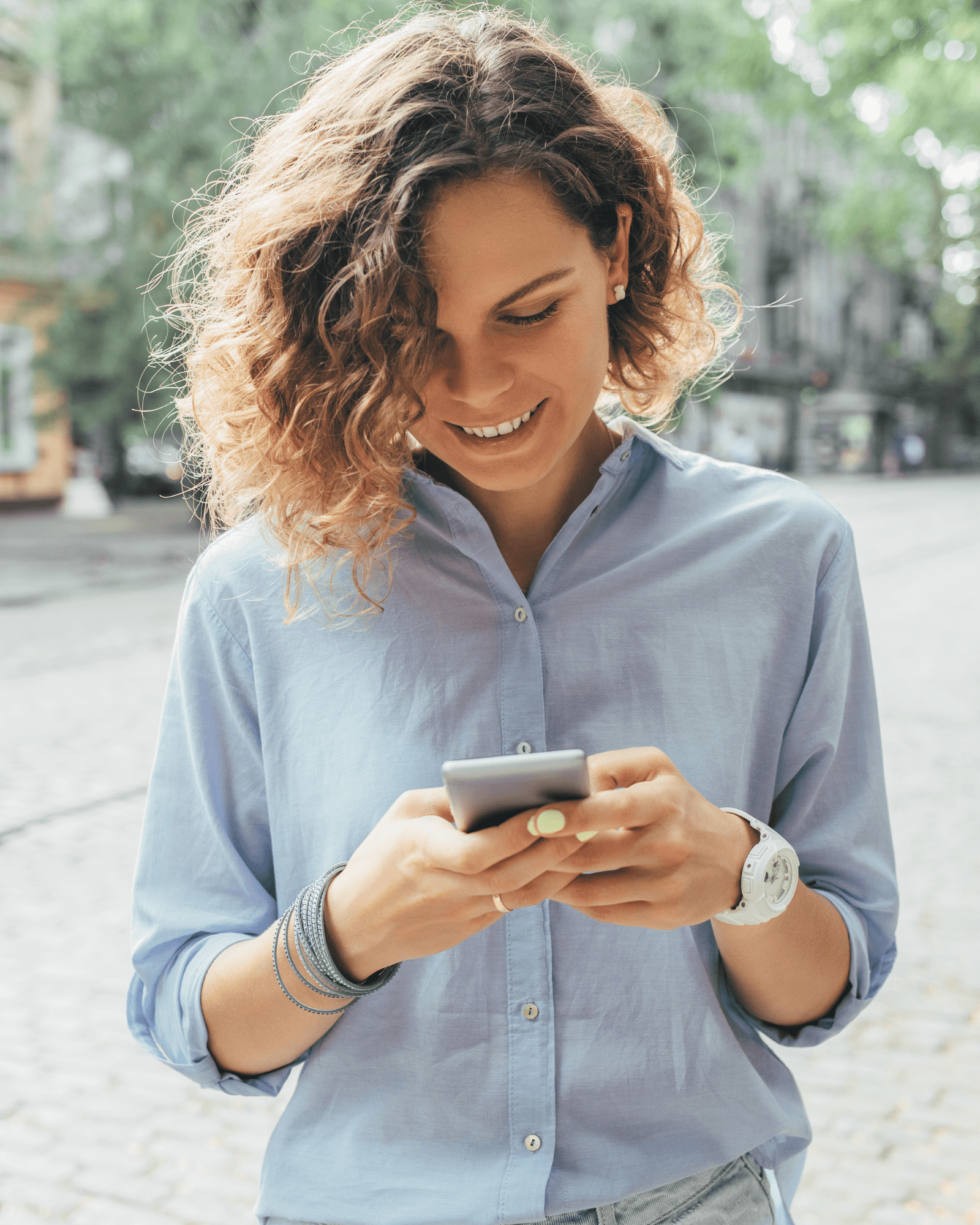 Person using Loclie app on their phone in town